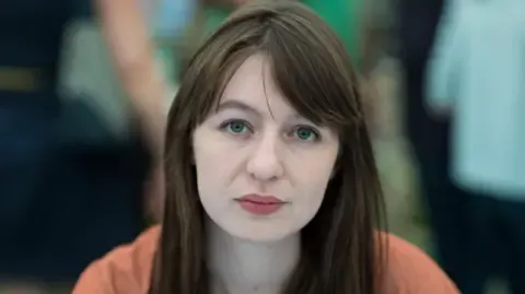 Irish author Sally Rooney states she cannot enter the UK because of potential arrest